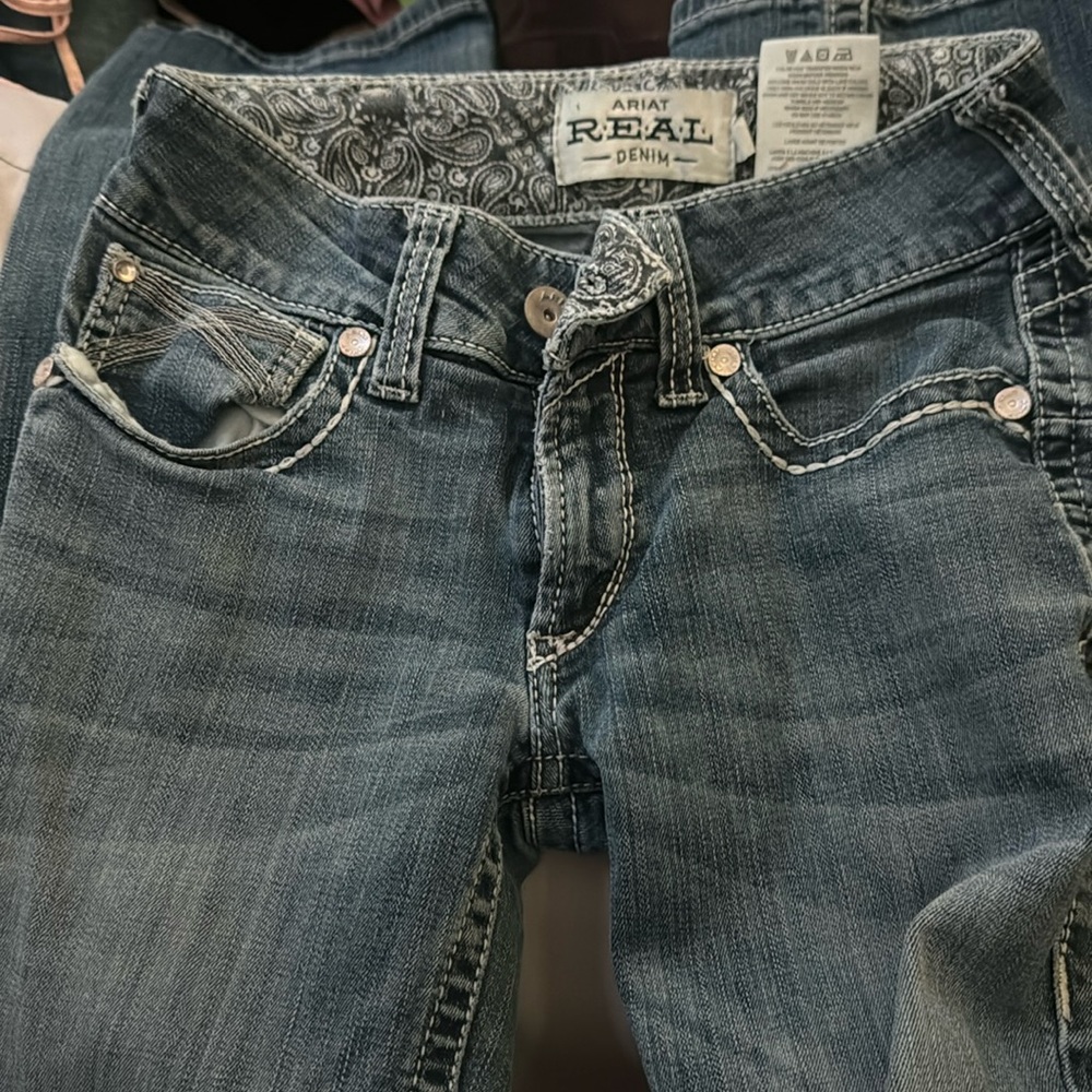 Ariat jeans straight legged worn in 2 rodeos.